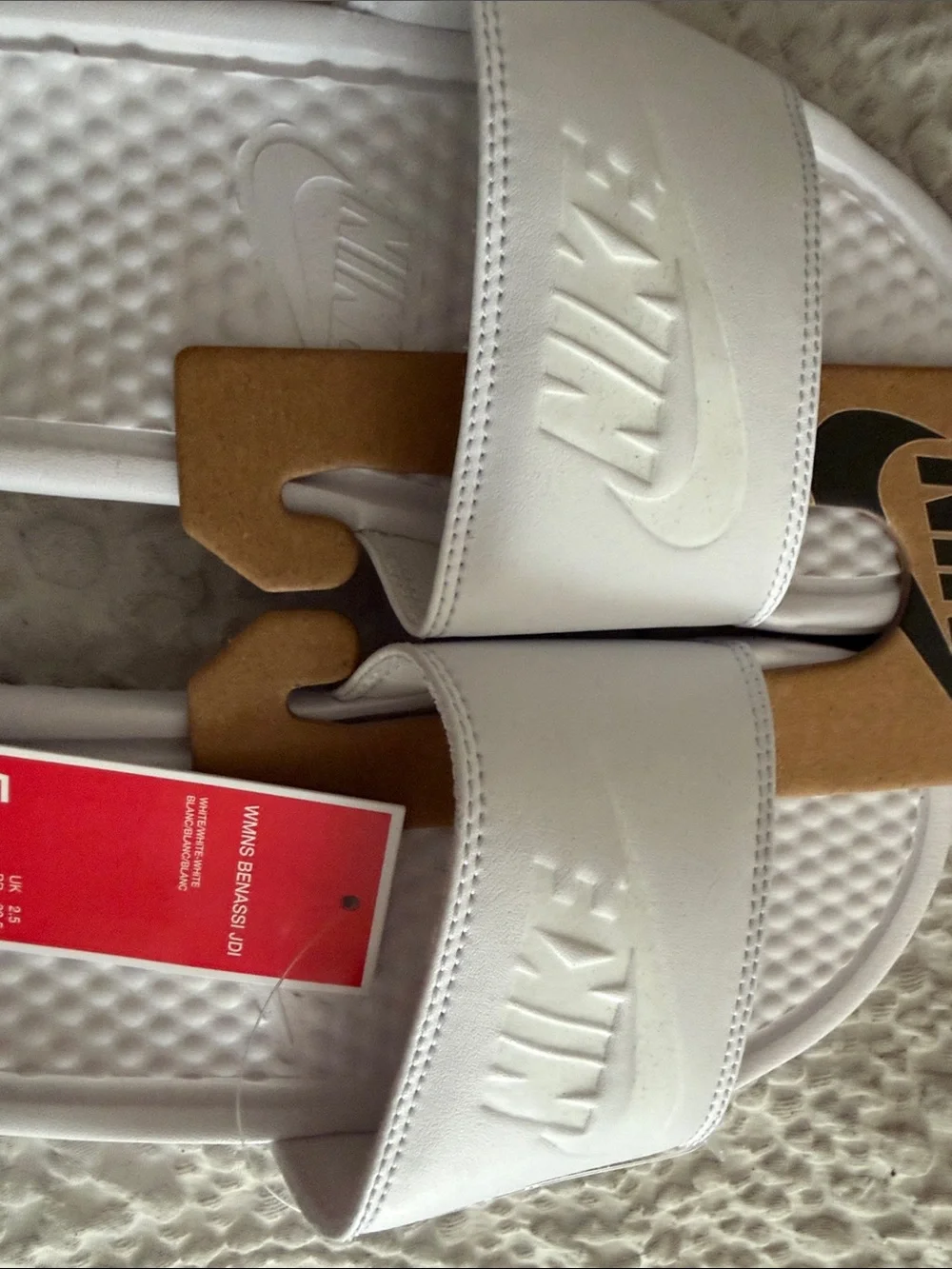 Nike White Kids Slide Sandals with Embossed Logo